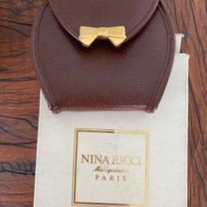 Nina Ricci leather coin purse, brown calf skin with gold bow